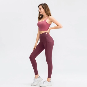Paarse yoga set voor dames met high-waist legging, sport-bh en handige zijzakken