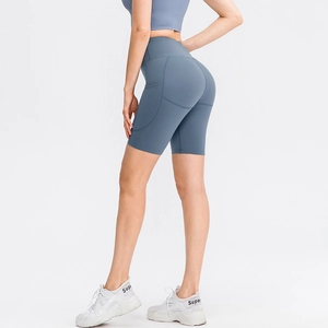 Pantaloncini yoga blu acciaio a vita alta da donna con tasche laterali e push-up