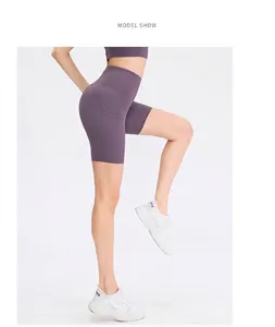 Detail view of purple high-waisted yoga shorts featuring side pockets for workout