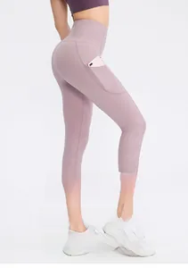 Detail view of high-waist lavender yoga capris featuring a side pocket and lifting seam