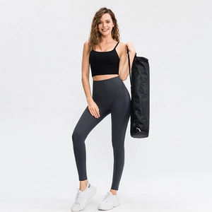 High-waisted dark grey yoga pants and black sports bra set for women fitness and workout