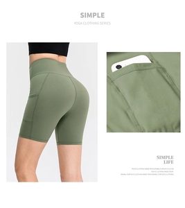 Macro detail of high waist yoga shorts with side pocket for smartphone storage