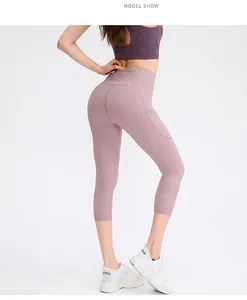 Detail view of high-waist lilac yoga leggings with convenient side phone pocket design