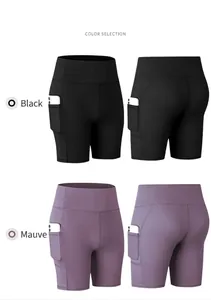 Detail view of high waist yoga shorts with side pockets in black and hibiscus purple