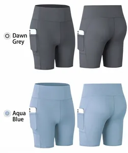 Detail of high-waisted yoga shorts with functional side pockets for phone storage