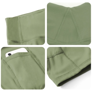 Sage green high waisted yoga shorts with side pockets and four-panel detail display