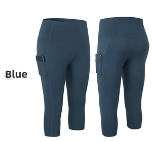 Detail of high-waisted blue yoga capris showing deep side pocket for smartphone storage