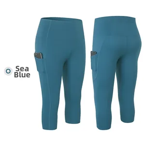 Detailed view of sea blue high-waist yoga capris with functional side phone pockets