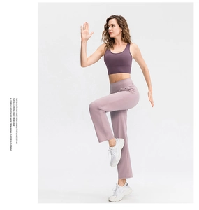Deep purple sports bra and lavender yoga pants set showing high elasticity and slim fit