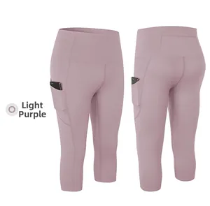 Detail of high waist yoga capris in light purple featuring back zipper pocket and side pockets