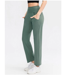 Detail view of high waist yoga pants in olive green with functional side pockets