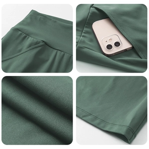 Detail of high waisted yoga pants with side pockets and premium double-stitched seams