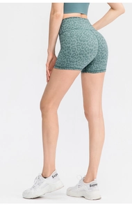 Rear view of high-waisted leopard print yoga shorts showing butt-lifting fit and texture