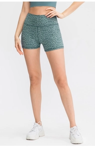 Detail of high-waisted camo print yoga shorts with breathable fabric for athletic wear