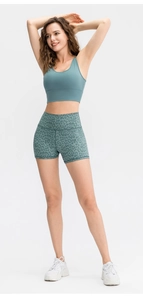 Detail of high-waisted leopard print workout shorts with elastic seamless fabric