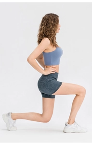 Side view of dark gray marble print high-waisted yoga shorts with seamless elastic fabric