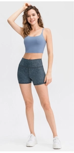 Detail of high-waisted grey marble print fitness shorts with high elasticity fabric