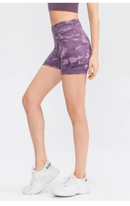 Detail of high-waisted purple camo yoga shorts featuring stretchy fabric for fitness