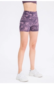 Detail view of purple camo high-waisted yoga shorts with seamless breathable fabric