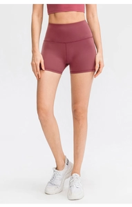 Detailed view of high-waisted seamless dark rose yoga shorts with elastic fit for fitness