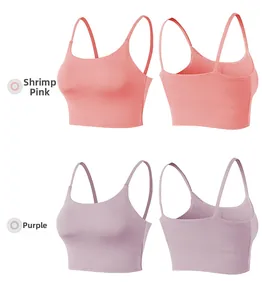 Detail view of shrimp pink and purple yoga tank tops with thin straps and padded design
