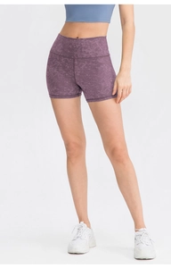 Detailed view of high-waisted compression yoga shorts with purple marble print