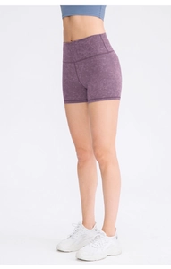 Detail of high-waist purple marble printed yoga shorts with butt-lifting compression fit
