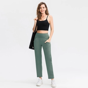 Women's high waist flared yoga pants with side pockets and black crop tank top