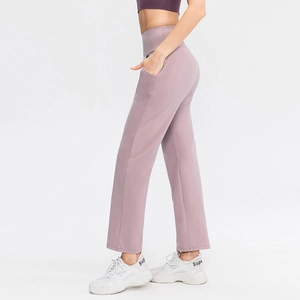 High-waist wide-leg yoga pants in dusty rose with side pockets and elastic fabric