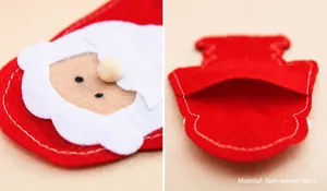 Dettaglio del portaposate Babbo Natale in tessuto non tessuto con cuciture frontali e posteriori