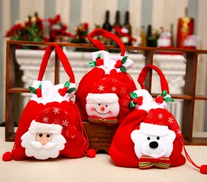 Detail of velvet Christmas drawstring gift bags featuring 3D Santa, Snowman and Bear