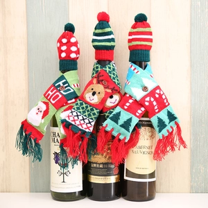 Three sets of Christmas knitted wine bottle hats and scarves with festive holiday patterns