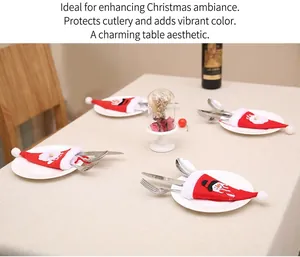 Miniature Christmas hat cutlery holders featuring Santa and Snowman patches on a white plate