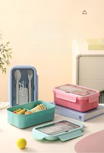 Three-compartment bento box set in blue pink and green with cutlery storage detail