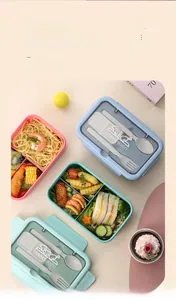 Three colorful multi-compartment bento boxes with cutlery in pink, blue and green colors