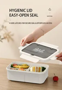 Detailed view of opening a compartmentalized bento box with a secure sealing lid