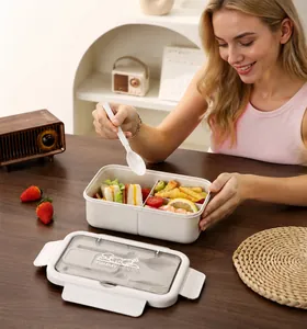 Détail d'une boîte à lunch bento écologique avec deux compartiments et porte-couvert