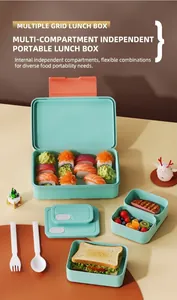 Detail view of mint green divided lunch box set with portable cutlery and food compartments