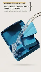 Water rinsing a blue compartmentalized lunch box showing the easy-to-clean feature