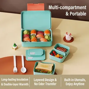 Mint green stackable bento box with separate compartments and portable cutlery set