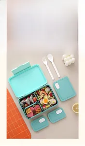 Detail view of mint green 3-compartment lunch box with reusable forks and spoons