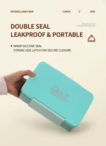Detail of mint green bento box lid with secure side buckles and leakproof silicone seal