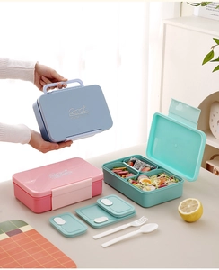 Three-compartment bento box set with built-in handles and matching cutlery in pastel colors
