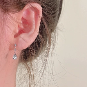 Light blue zircon drop tassel earrings in silver with minimalist dangling star detail