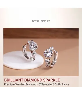 Detail view of silver hoop earrings with 57-facet brilliant cut faux diamonds