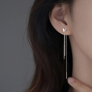 Elegant S925 silver butterfly tassel earrings on model with vertical drop chains