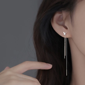 925 silver plated butterfly tassel earrings worn by a model in a close-up shot