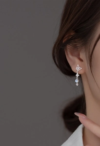 Elegant S925 silver asymmetric butterfly drop earrings with glowing moonstone beads