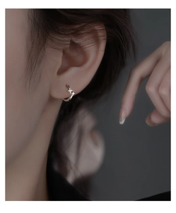 Close-up of S925 silver star hoop earrings with micro-set zircon stones on model