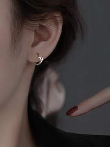 Close-up of S925 silver starburst hoop earrings featuring micro-pave cubic zirconia